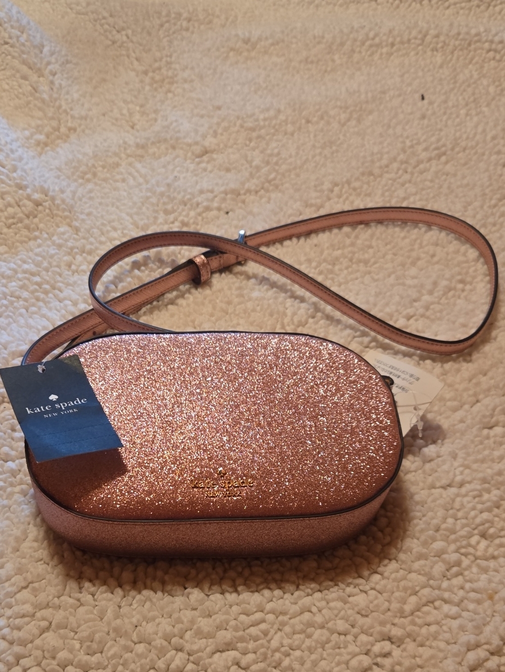 kate spade Rose Gold Glitter Oval Crossbody Bag